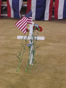 Cross with flag and flowers
